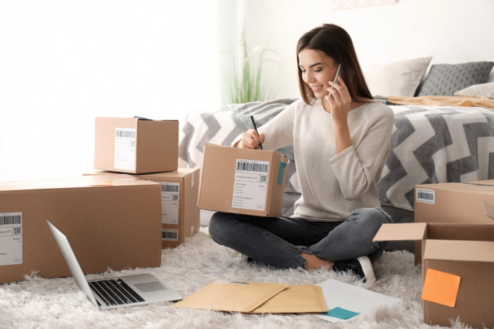 woman-talking-on-the-phone-with-shipment-boxes