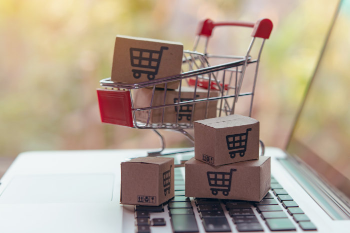 small-shopping-cart-with-boxes-on-laptop