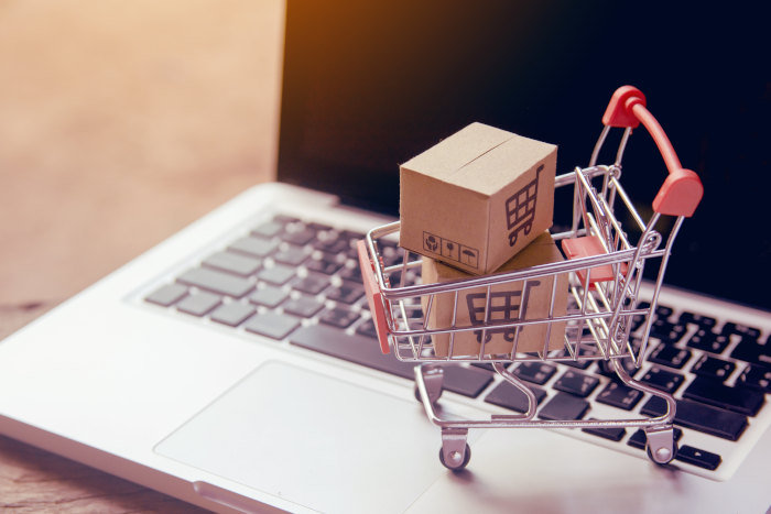 small-shopping-cart-with-boxes-on-laptop