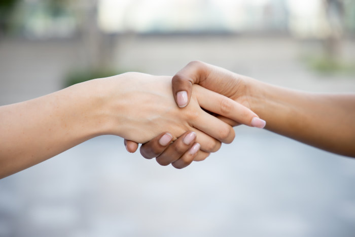 women-shaking-hands